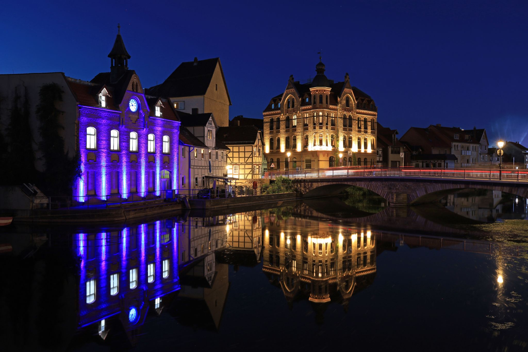 Photo of illuminated downtown and reflection on the river Werra in Eschwege
