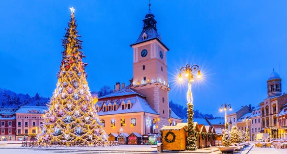 Photo of Brasov, Romania. Medieval Council House in the Main Square at winter of the Old Town.