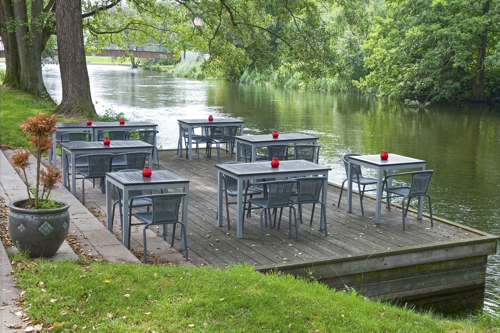 Cafe tables at a small river in Silkeborg, Denmark