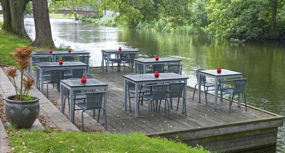 Cafe tables at a small river in Silkeborg, Denmark