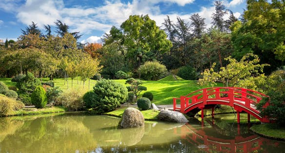 Photo of Japanese Garden with small pond on a sunny day. Compans Caffarelli district, Toulouse, France.