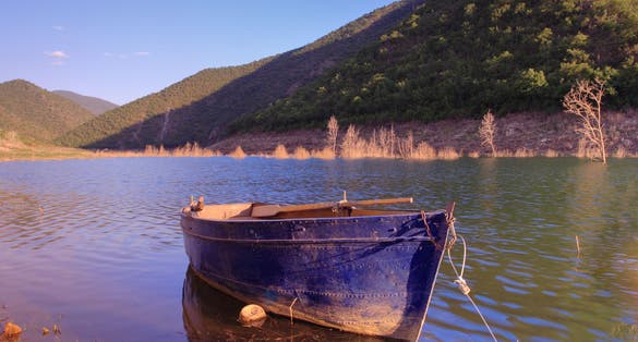 Photo of boat anchored on Kozjak lake, Macedonia.