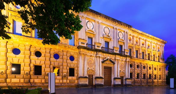 Photo of Evening view of Facade of the Palace of Charles V at Alhambra. Granada, Spain .