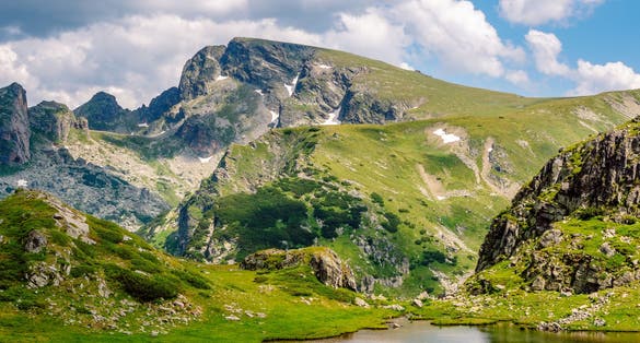 photo of view of Picturesque summer mountain landscape with a lake and an impressive peak in the background. One of the Urdini Lakes and Malyovitsa Peak in Rila Mountain, Bulgaria.,Kyustendil bulgaria.