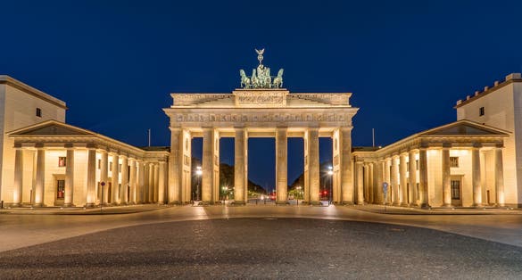 photo of view of Berlin's most famous landmark, the Brandenburg Gate, at night, Germany.