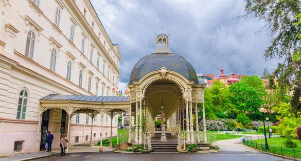 Photo of Park Colonnade with wooden arbor in Dvorak Park Dvorakovy sady in Karlovy Vary (Carlsbad) historical city centre, West Bohemia, Czech Republic.
