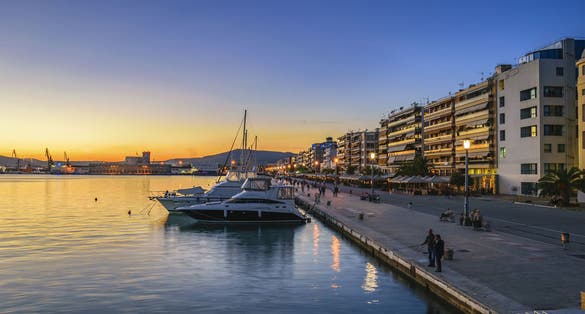 Photo of sunset at the port of Volos city, the capital of the Magnesia regional unit, Greece.