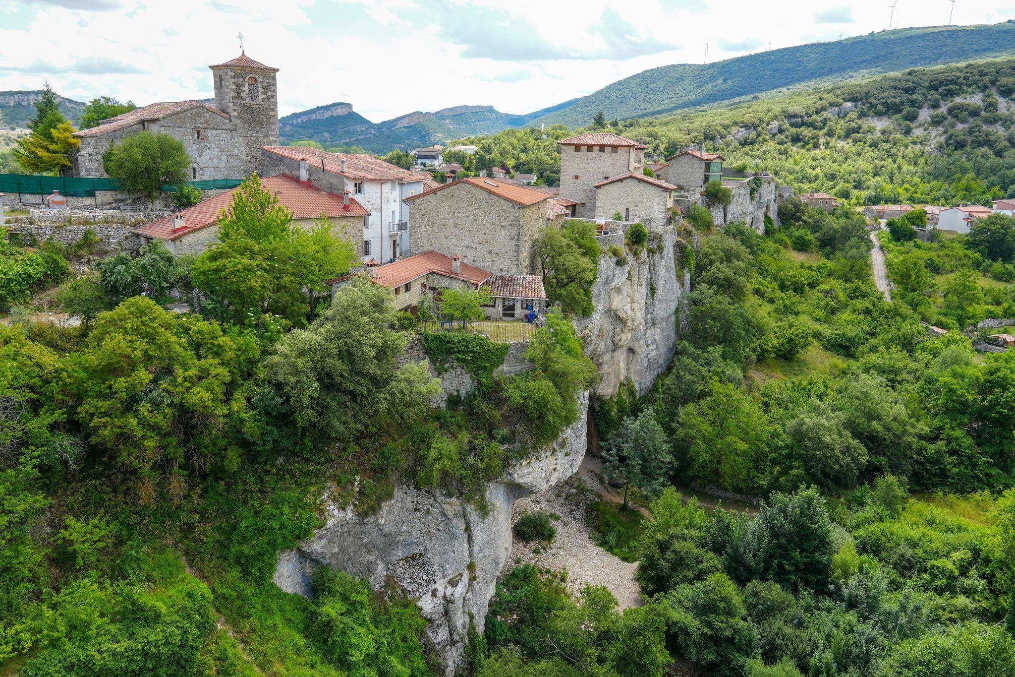 photo  of view of Puentedey in Burgos province Spain on July 11, 2024. It is a rock arch that the river Nela has been carving for millions of years on which a town has been built. Panorama from the viewpoint.