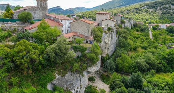photo  of view of Puentedey in Burgos province Spain on July 11, 2024. It is a rock arch that the river Nela has been carving for millions of years on which a town has been built. Panorama from the viewpoint.