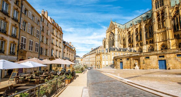 Photo of street view on the central square with famous cathedral in Metz city in Lorraine region of France.