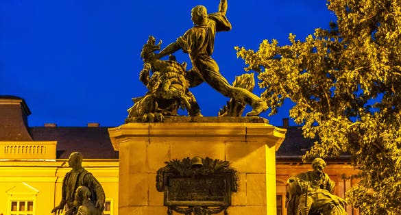 photo of view of View on the historic statue of Nyiregyhaza, Hungary, Europe on at night.