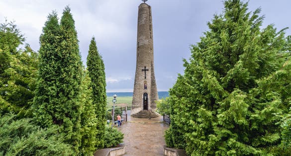 Photo of Thanksgiving or Gratitude Candle, tall candle-shaped monument in Soroca city, Moldova.