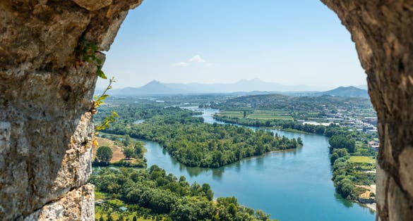 Photo looking at the lake from the arch of the Rozafa Castle wall in the city Shkoder. Albania.