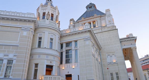 photo of view of Top view of Arad, Romania cityscape with the Orthodox Cathedral and the surounding buidings. Photography was shot from a drone at a higher altitude.