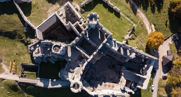 Photo of aerial view ruins of medieval castle on the rock in Ogrodzieniec, Poland.