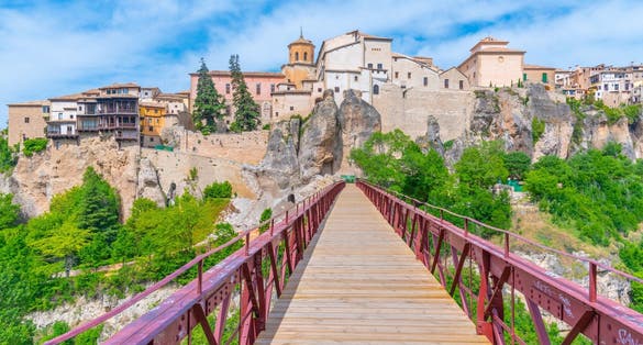 photo of beautiful morning view of San Pablo bridge over river Huecar in Cuenca, Spain.