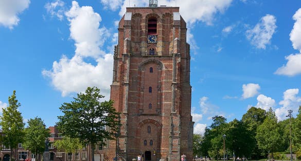 photo of Oldehove an unfinished and leaning church tower in the medieval center of the Dutch city of Leeuwarden, the Netherlands.