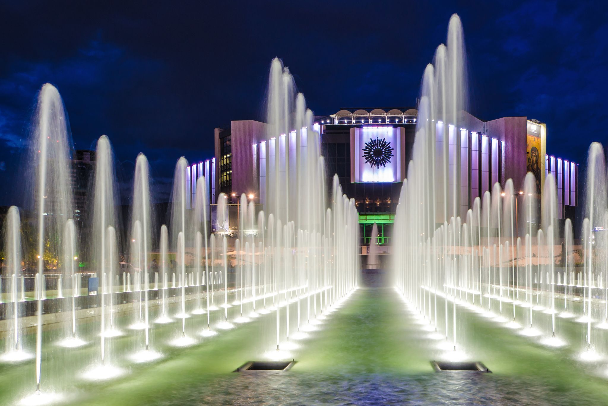Photo of night scene fountains in front of the National Palace of Culture, Sofia, Bulgaria.