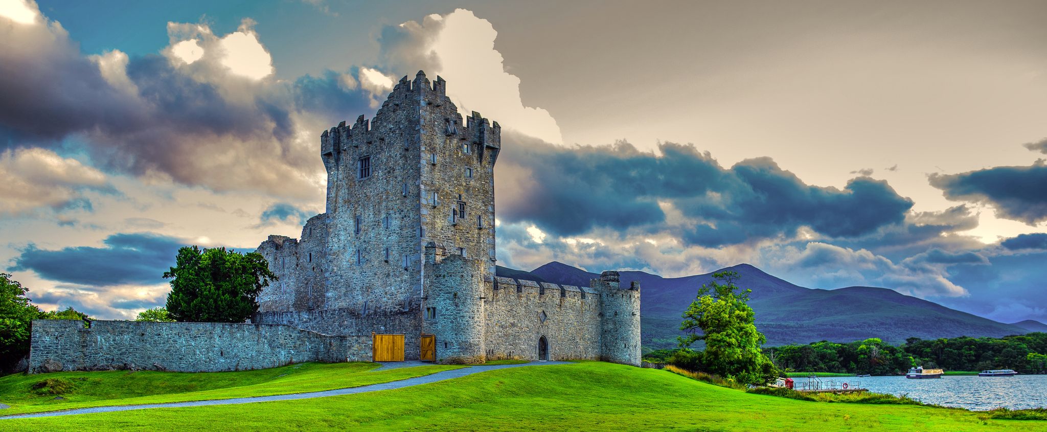 photo of view of Idyllic landscape of Ross Castle in the Killarney National Park in Ireland. Travel by car through the Ring of Kerry, Irland.