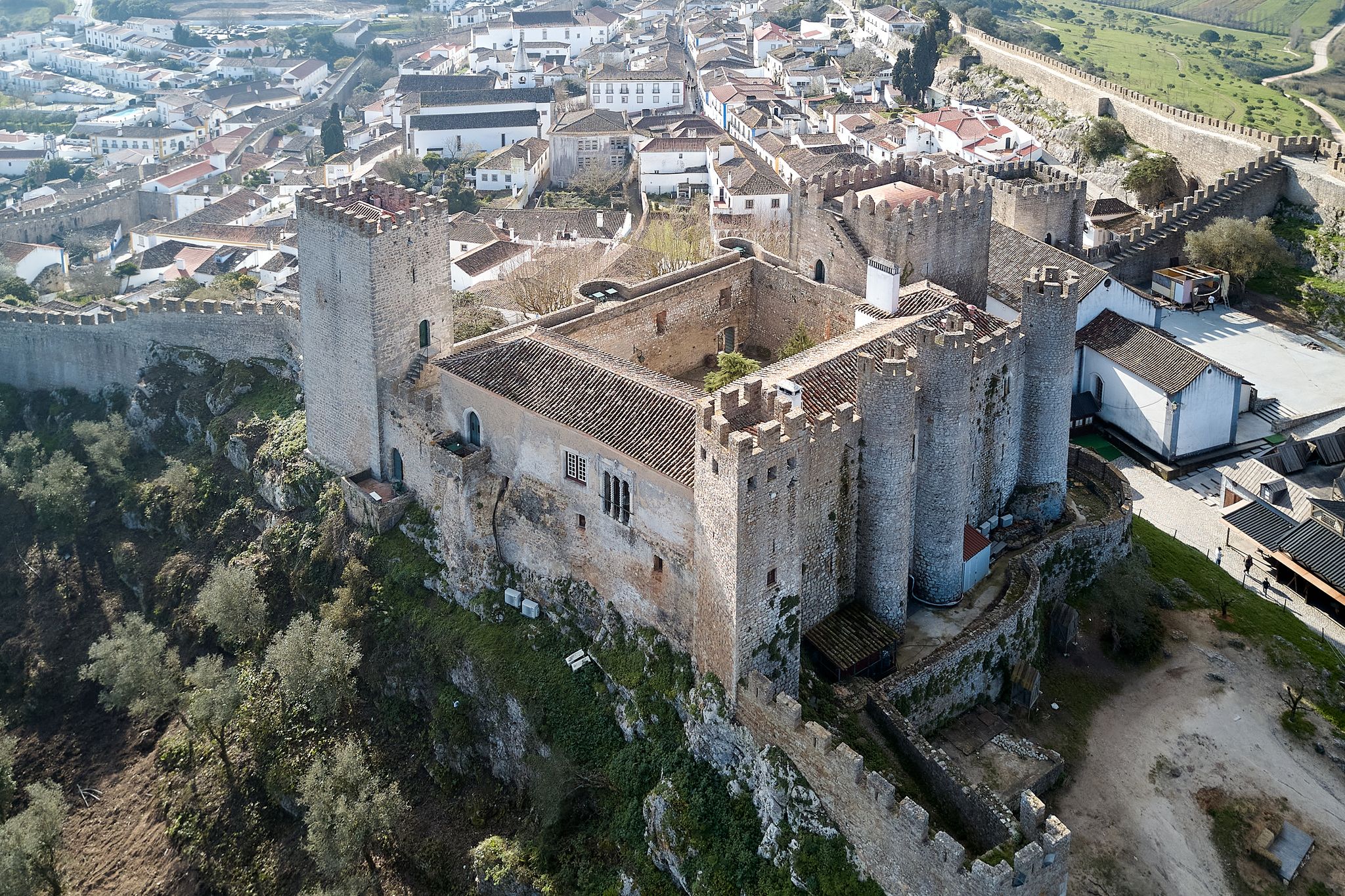 Photo of aerial view of Stone masonry Castle of Obidos and wall ruins or Castelo de Óbidos is a well-preserved medieval castle located in the civil parish of Santa Maria, Portugal.