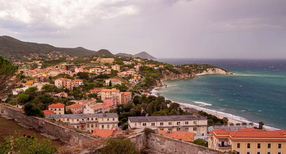 View from Forte Falcone over City of Portoferraio to Padulella beach and Capo D' Enfola, Isola D' Elba (Elba Island), Tuscany (Toscana), Italy.