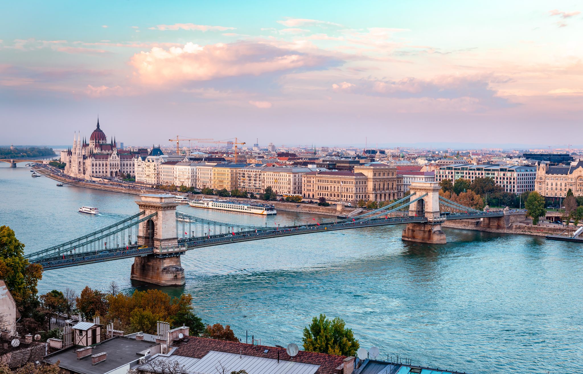 Photo of the river Danube, the Chain Bridge and the Pest skyline in Budapest, Hungary.