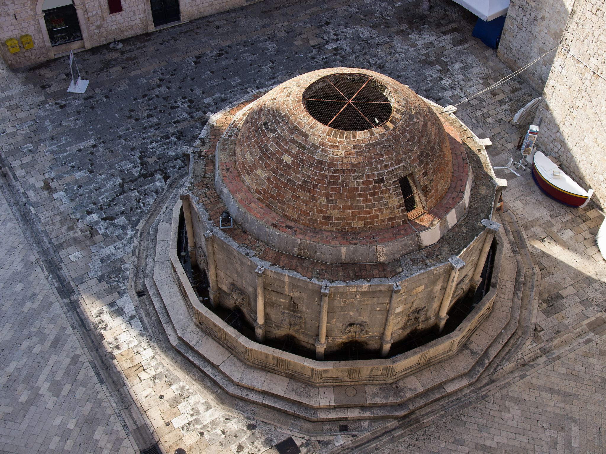 Photo of aerial view of large Onofrio Fountain on the Square at Stradun Street in the Old city of Dubrovnik, Croatia.