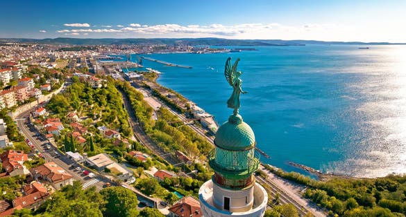 Trieste lighthouse Phare de la Victoire and cityscape panoramic aerial view, Friuli Venezia Giulia region of Italy.