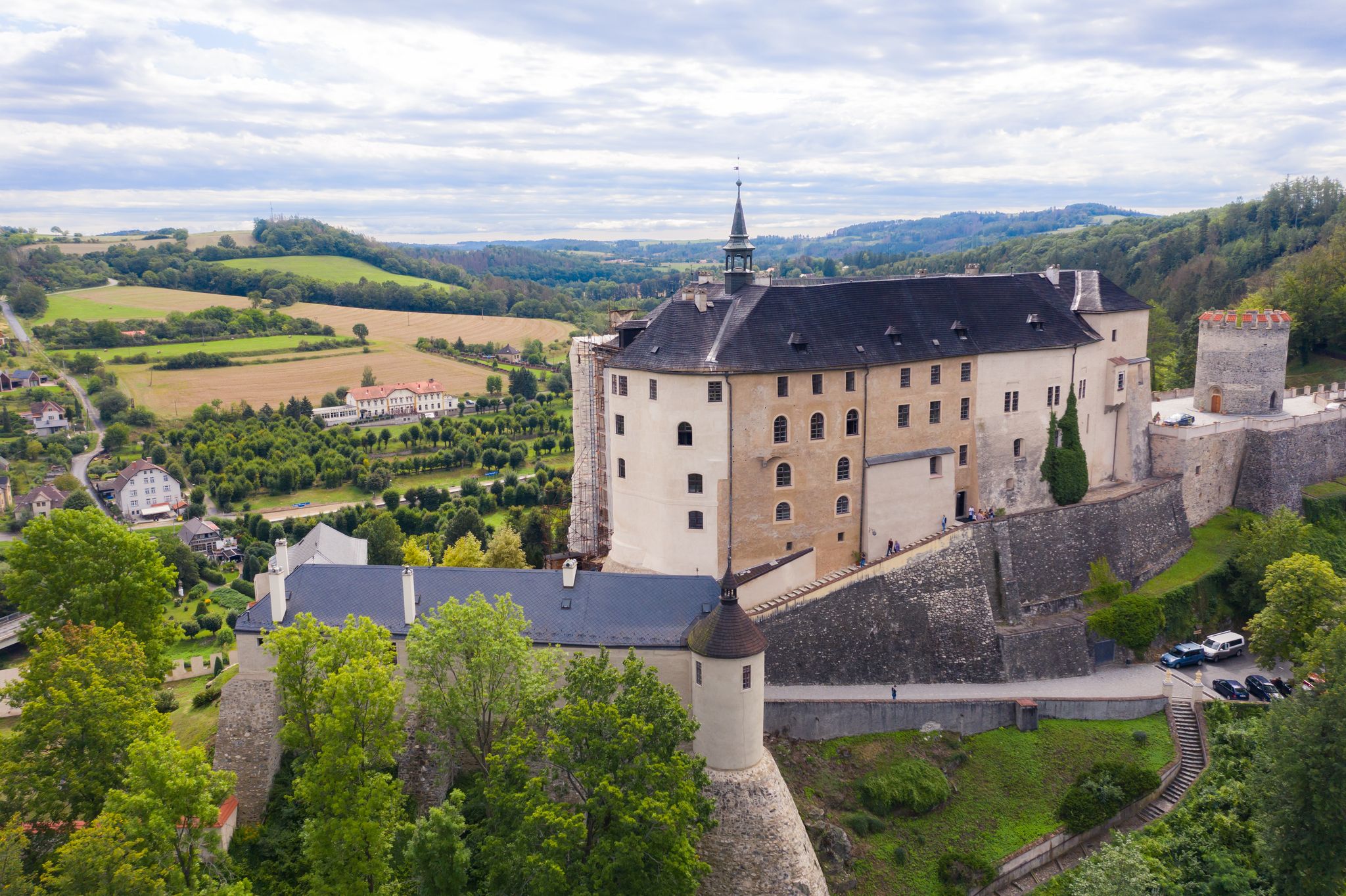 Photo of aerial view of Český Šternberk Castle on top of hill overlooking Czech countryside in Bohemian region, Czech Republic.