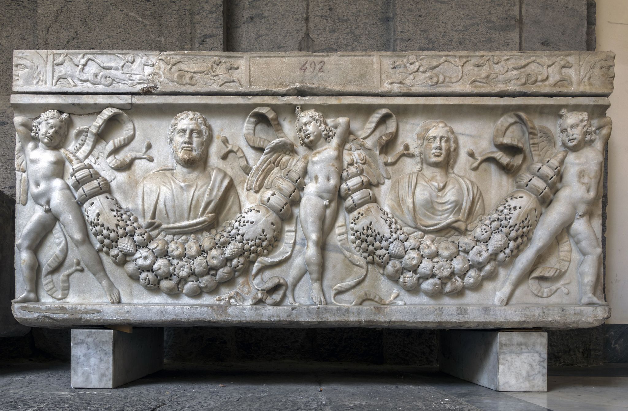 photo of NAPLES, ITALY - JULY 22 2015: 4th century AD Roman sarcophagus depicting the legend of Prometheus creating the first man on display in the Naples National Archaeological Museum.