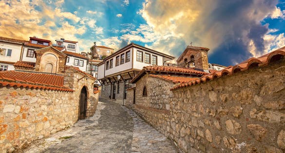 Photo of narrow street in the old town of Ohrid on a beautiful sunset, North Macedonia.