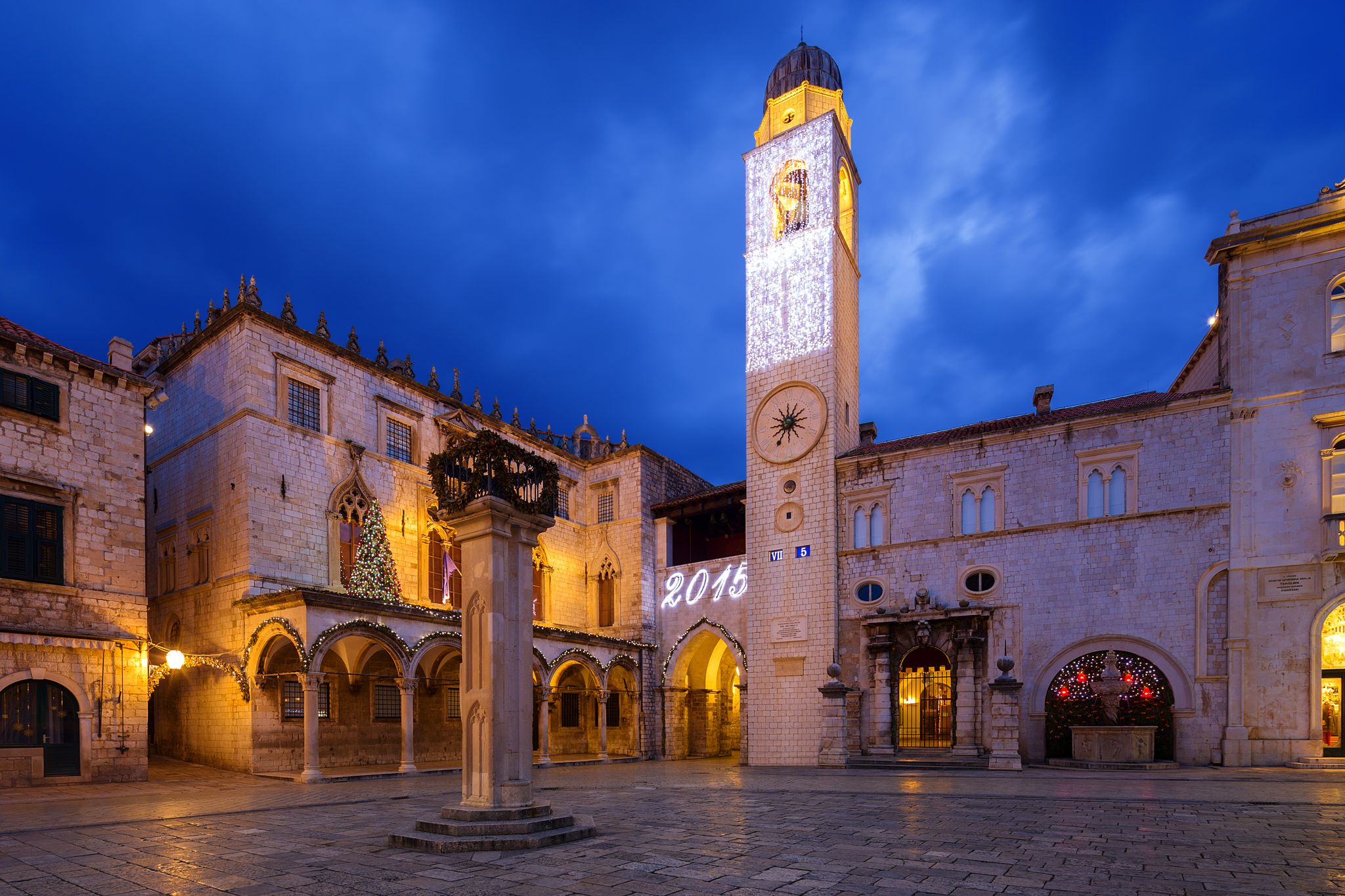 Photo of the Sponza palace at night in Dubrovnik, Croatia.