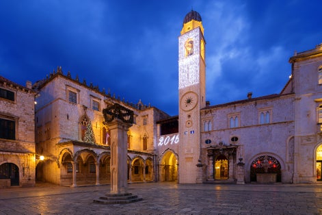Photo of the Sponza palace at night in Dubrovnik, Croatia.