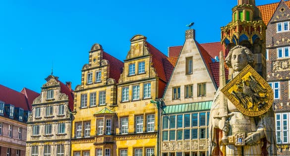 Photo of colorful facades with bremer roland statue in Bremen, Germany.