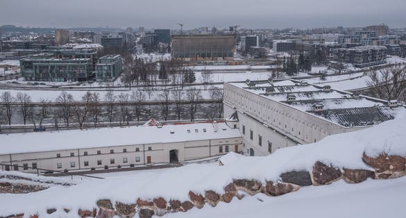 Winter view of the Lithuanian National Museum and the Museum of Applied Art with Neris river and Vilnius downtown in the background, as seen from Gediminas Tower hill, Vilnius, Lithuania