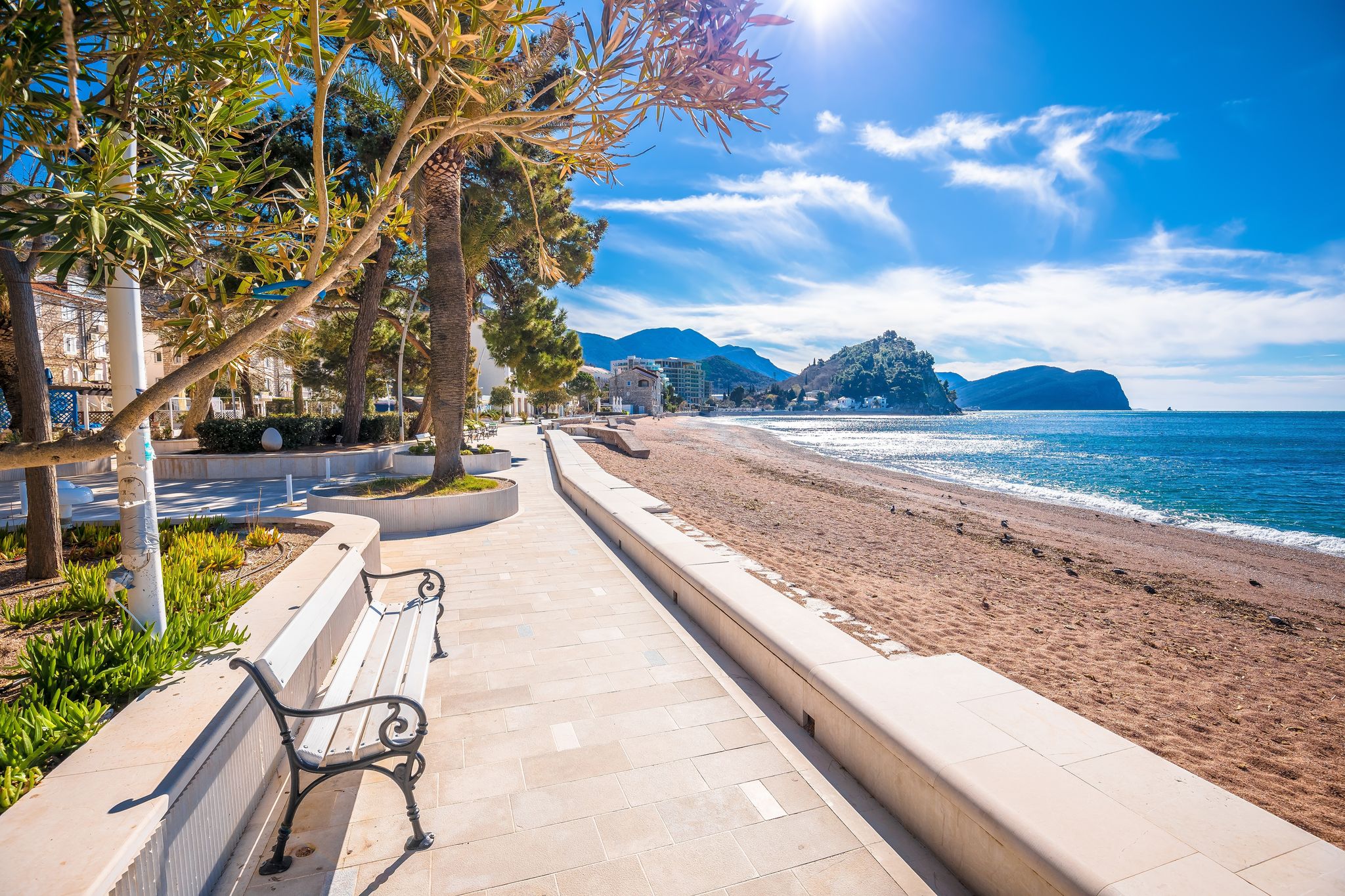 Photo of Town of Petrovac beach and coastline aerial view, archipelago of Montenegro.
