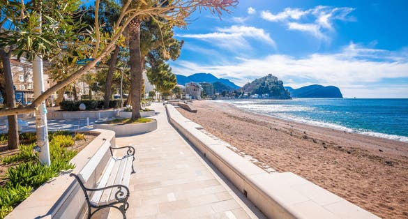 Photo of Town of Petrovac beach and coastline aerial view, archipelago of Montenegro.