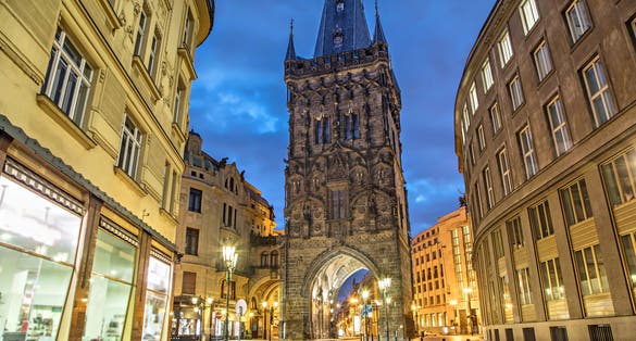 Photo of the Powder Tower by night medieval gothic city gate in Prague, Czech Republic.
