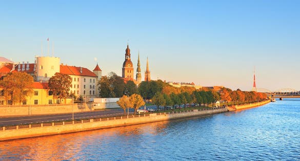 Aerial view of Riga embankment on a sunny day. Panoramic autumn cityscape. Fortress, cathedral and railway bridge close-up. Vacations in Latvia, travel destinations, national landmarks, sightseeing