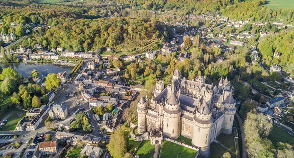 photo of aerial view over the beautiful Castle of Pierrefonds in Pierrefonds, France.