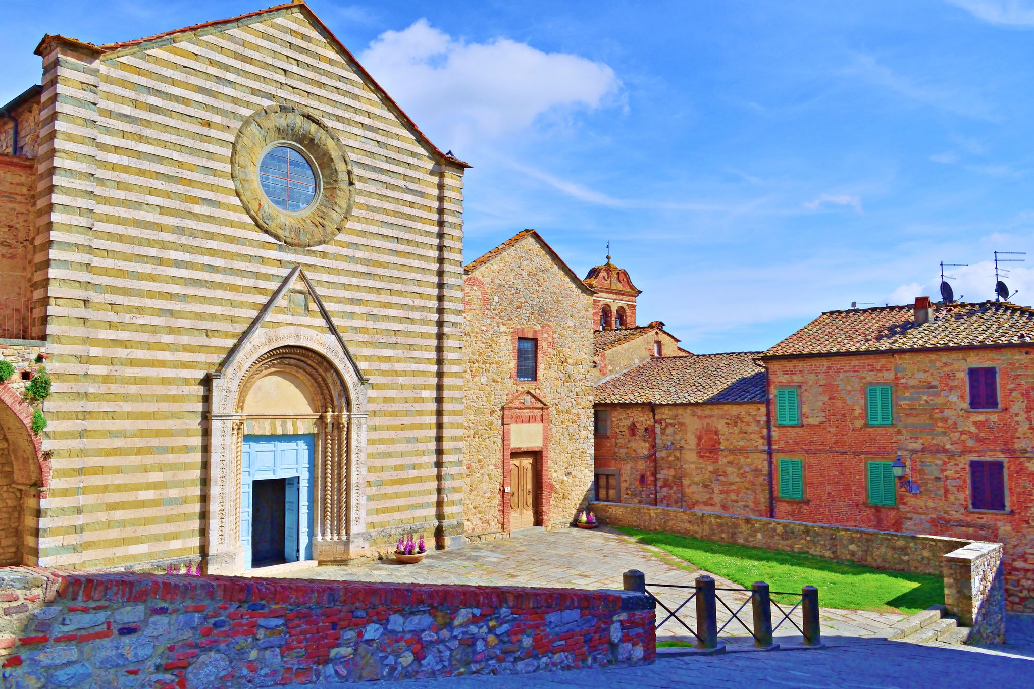 exterior facade of the 13th century Church of San Francesco located in the medieval Tuscan village of Lucignano in Arezzo, Italy.