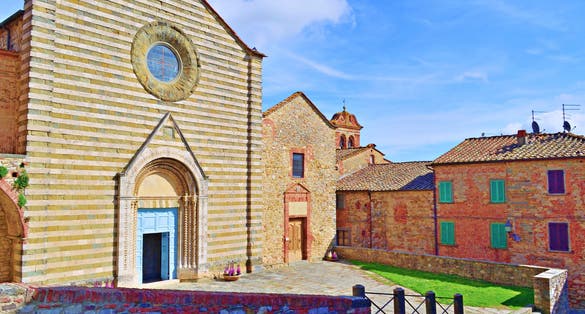 exterior facade of the 13th century Church of San Francesco located in the medieval Tuscan village of Lucignano in Arezzo, Italy.