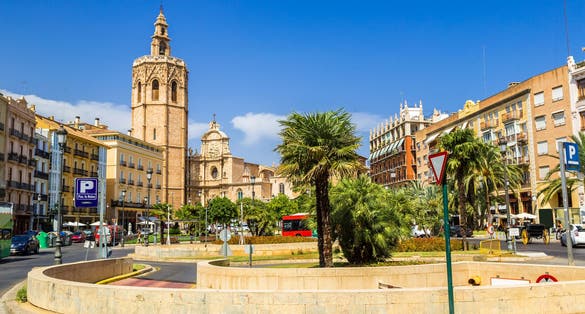 Photo of Bell tower and Valencia Cathedral in Valencia in a summer day, Spain .