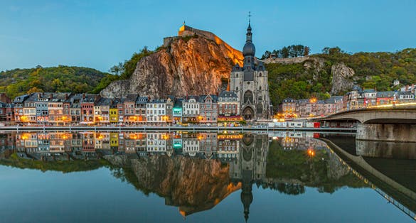 Classic view of the historic town of Dinant with scenic River Meuse in beautiful golden evening light at sunset, province of Namur, Wallonia, Belgium