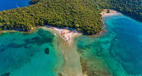photo of aerial drone bird's eye view of Bella Vraka Beach with turquoise sea in complex islands in Sivota area near to Igoumenitsa , Ionian sea, Epirus, Greece.