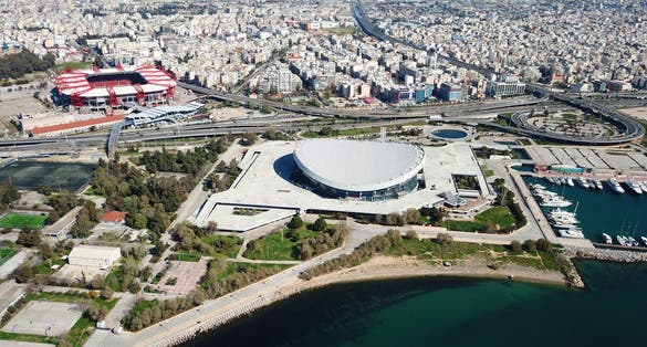 Photo of Aerial birds eye view photo taken by drone of Peace and Friendship public stadium and Karaiskakis stadium, Piraeus, Attica, Greece.