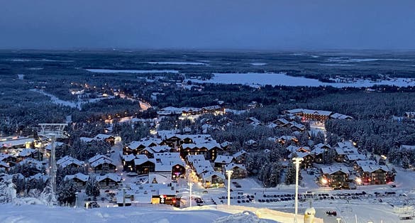 View of the town of Sirkka from Levi fell in Lapland, Finland. Main ski slope is to the right, and the cable supports for the gondola are visible to the left.