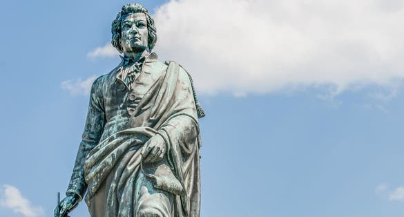 photo of view of Mozart statue on Mozart Square (Mozartplatz) located at Salzburg, Austria.