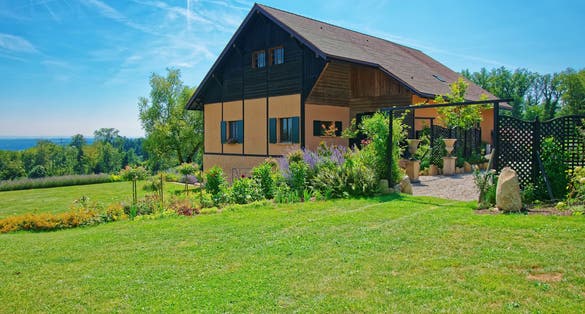 Photo of Swiss House in a village in Yverdon les Bains at Jura Nord Vaudois district of Canton Vaud, Switzerland.