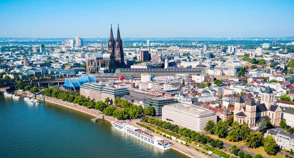 photo of view of Cologne Cathedral and Hohenzollern Bridge through Rhine river aerial panoramic view in Cologne, Germany